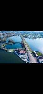 an aerial view of an island in a body of water at La Tiny house in Ardres