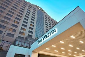 a building with a sign on the front of it at The Westin Indianapolis in Indianapolis