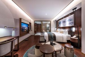 Televízia a/alebo spoločenská miestnosť v ubytovaní New Century Hotel Qianchao Hangzhou