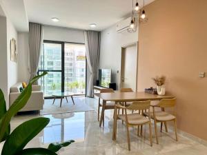 a living room with a dining room table and chairs at The Ascentia - Scandinavian apartment - Near SECC, Mall in Ho Chi Minh City