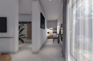 a hallway of a house with a living room at Maison Meltem in Agia Pelagia