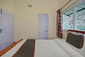 Postel nebo postele na pokoji v ubytování STARLIGHT HOTELS KODAI