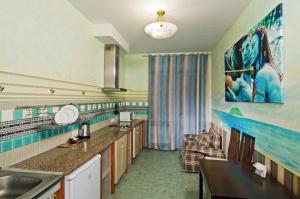 a kitchen with a sink and a counter top at Lukyanovsky in Kyiv