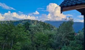 a view of the mountains from a house at Dal Point view in Srinagar