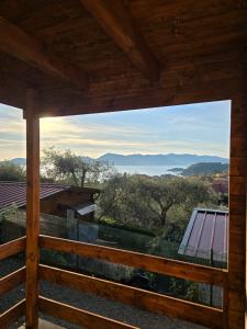 a view from the deck of a house with a large window at Campeggio Gianna Golfo dei Poeti in Lerici