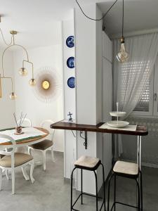 a dining room with a table and some chairs at DOMUSDONA in Grottammare