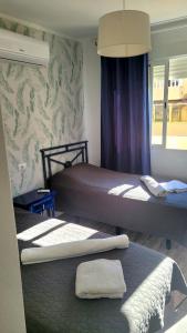 Postel nebo postele na pokoji v ubytování Apartments + 7 fotografií
