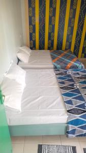 Tempat tidur dalam kamar di Sunshine Appartments