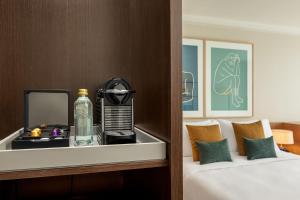 A bed or beds in a room at AC Hotel Gava Mar