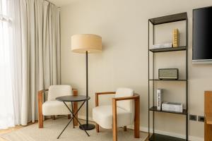 A television and/or entertainment centre at AC Hotel Gava Mar