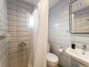 a bathroom with a toilet and a sink and a shower at BedCity Apartment with Free Parking in the City Center in Thessaloniki