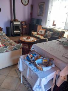 a living room with a table with a cake on it at Il Laghetto in Torre Canavese