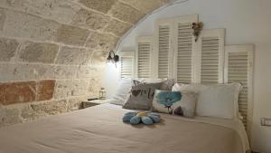 Säng eller sängar i ett rum på B&B Casa Fiore