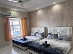 Ένα ή περισσότερα κρεβάτια σε δωμάτιο στο Setia 9 Austin Near LongSing YiJia HeLiXuan New Cathay Restaurant