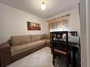 a living room with a couch and a table at Sea House in Vlorë