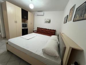 a bedroom with a large bed in a room at Sea House in Vlorë