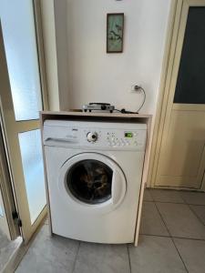 a washer and dryer sitting in a room at Sea House in Vlorë