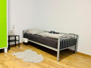 a bedroom with a bed and a rug at Zur Guten Stube - Self Check In- 