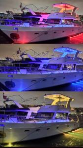 a group of boats in the water at night at ESESYATTURİZM in Istanbul
