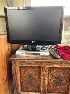 a television sitting on top of a wooden table at Retro Mobile glamping - Near Dartmoor walks in Exeter