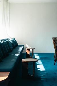 a living room with a couch and a table at koti hakone（コティ箱根） in Hakone +80 photos