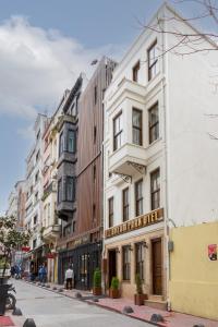 a white building on a city street at Dream Park Hotel in Istanbul