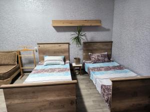 Postel nebo postele na pokoji v ubytování Уютная квартира возле ТЦ Вавилон, Ж/м Солнечный, Малиновского 12, 1-к