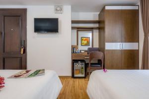 Postel nebo postele na pokoji v ubytování Silana Beachfront Hotel & Spa