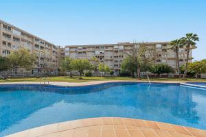 a large swimming pool in front of a building at Skyline 21 in Torrevieja