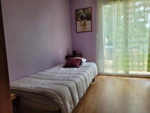 Postel nebo postele na pokoji v ubytování La Capeline