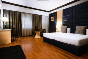 Letto o letti in una camera di Hotel Pal Heights