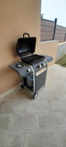 a bbq grill sitting on top of a patio at Villa Carol in Santa Maria di Castellabate