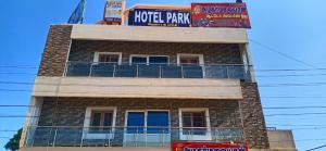 a building with a sign on top of it at Hotel Park Sivagangai in Sivaganga