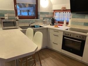 Kuchyň nebo kuchyňský kout v ubytování "Casita linda "am Donnersberg + 34 fotografií
