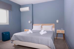 Postel nebo postele na pokoji v ubytování antéste Ierapetra sea & city