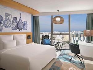 Postel nebo postele na pokoji v ubytování Mövenpick Hotel & Apartments Ghala Muscat