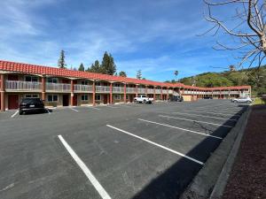 a parking lot in front of a large building at Motel 6 Martinez, CA in Martinez
