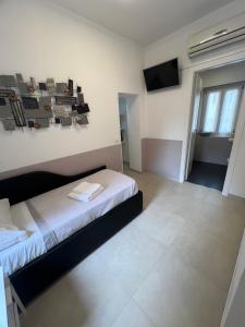 Postel nebo postele na pokoji v ubytování Affittacamere Sull'Arco