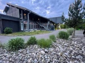 a building with a bunch of rocks in front of it at Sweet Rooms in Bubesheim
