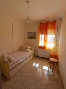 Ένα ή περισσότερα κρεβάτια σε δωμάτιο στο Dimar1 Seaside Apartment