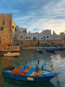 a group of boats in the water near a city at Diamantea in Monopoli