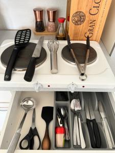 a white drawer with utensils in it at City Center Studio at town hall in Basel