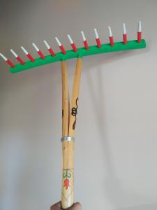 a group of three baseball bats in a rack at Na Dziole in Lipnica Wielka