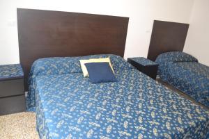 Letto o letti in una camera di Incantoromano guest house