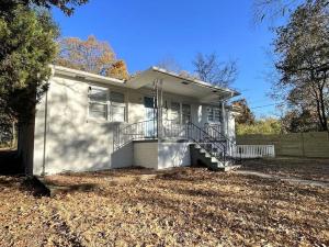 a small white house with a porch and stairs at Stay @ The Birchwood/Remodeled & 15 min to DT in Birmingham