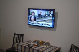 TV o dispositivi per l'intrattenimento presso Incantoromano guest house
