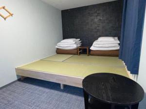 Postel nebo postele na pokoji v ubytování GuestHouse Guu