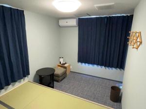 Postel nebo postele na pokoji v ubytování GuestHouse Guu