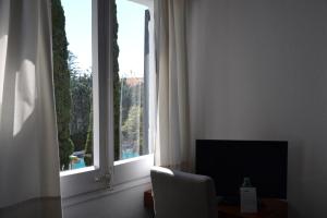 TV a/nebo společenská místnost v ubytování Hotel Misty