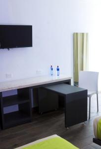 TV a/nebo společenská místnost v ubytování Global Express Hotel Escarcega